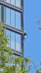 Window cleaner performs maintenance work on Khimki high-rise building