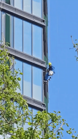 Window cleaner performs maintenance work on Khimki high-rise building