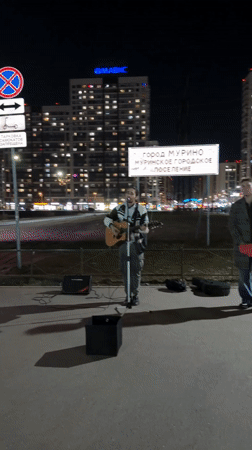 Street musician performs acoustic set in Murino, Russia