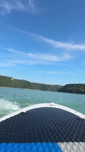 Paddleboarding and splashing around on a sunny French lake