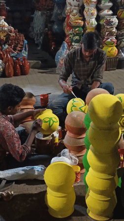 Artisans paint traditional handicrafts at Dhaka street market