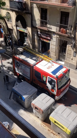 Fire Engine 'BOMBERS 112' Parked on City Street