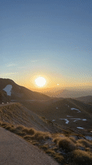 Woman Documents Sunrise Mountain Drive in Montenegro