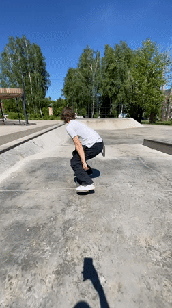 Skateboarding tricks at a concrete park in Divnogorsk