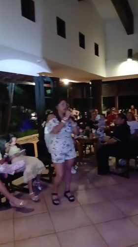 Live music and birthday cake at a Playa El Agua gathering