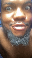 Man recorded making facial expressions indoors in Jos, Nigeria