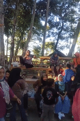 Community market day in Karungan with food stalls and festive flags