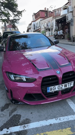 Pink BMW M4 with racing stripes spotted across Veliko Tarnovo