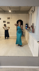 Mirror selfies in a Sochi dance studio, teal outfit and fan