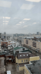 Office worker documents rainy day workspace in Perm