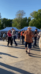 Park hosts swing dancing, living statue performer amid tulip blooms
