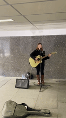 Street musician, tourists capture ordinary Moscow afternoon moments