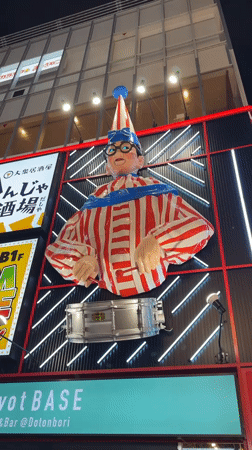 Large illuminated clown figure spotted on Osaka building exterior