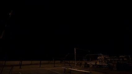 Nighttime playground scene documented in Russia with construction crane