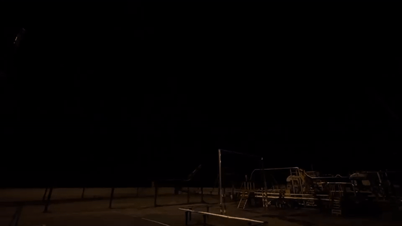 Nighttime playground scene documented in Russia with construction crane