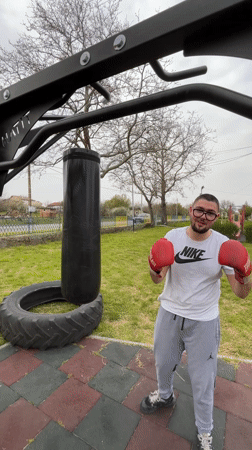 Man trains with punching bag at playground in Polski Izvor