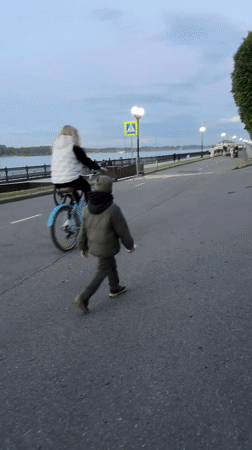 Child walks along river embankment in Yaroslavl