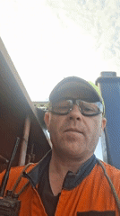 Worker records video aboard marine vessel