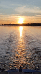 Peaceful sunset observed over waters near Bol'shie Mkhi, Russia