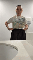 Woman takes bathroom selfies in Mexico City late night