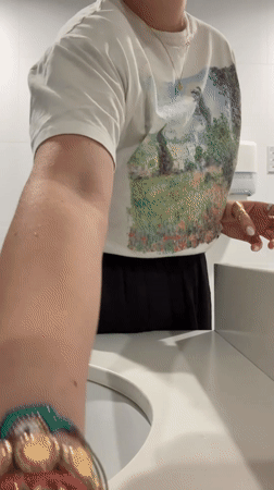 Woman takes bathroom selfies in Mexico City late night