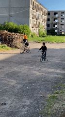 Two cyclists spotted on dirt path in Gyumri, Armenia