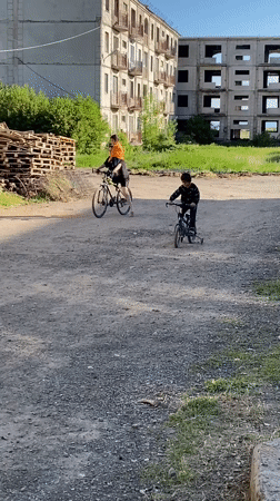 Two cyclists spotted on dirt path in Gyumri, Armenia