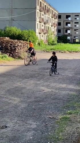 Two cyclists spotted on dirt path in Gyumri, Armenia
