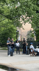 Film crew sets up equipment in New York park