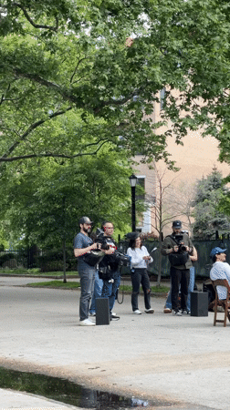 Film crew sets up equipment in New York park