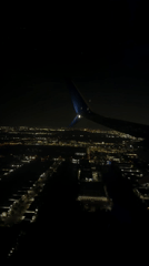 Nighttime aerial view of Naples, Florida captured from airplane