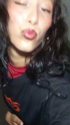 Woman documents selfie session indoors in Porlamar, Venezuela