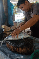 Early morning fish preparation at Lhokseumawe seafood market
