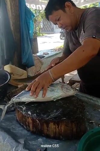 Early morning fish preparation at Lhokseumawe seafood market