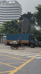 Dhaka street scenes show rickshaws, commerce in urban district