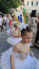 Children in tutus gather for street performance in Montenegro