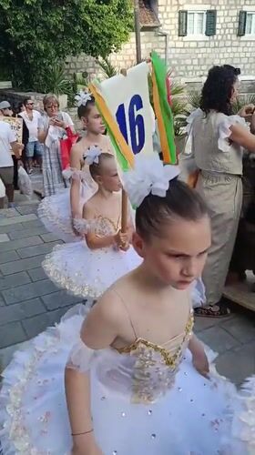 Children in tutus gather for street performance in Montenegro