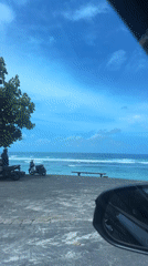 Tropical coastline view captured from vehicle in Kuta Selatan