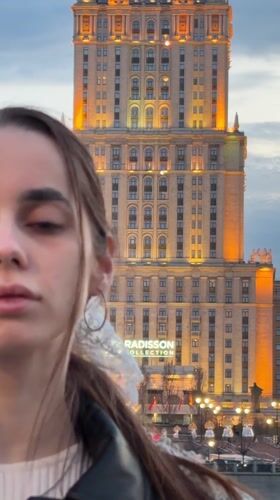 Woman photographed outside Radisson hotel building in Moscow