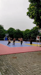 Basketball court and shaded walkway at an East Jakarta facility