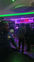 Late night socializing at Nairobi bar with colorful lighting