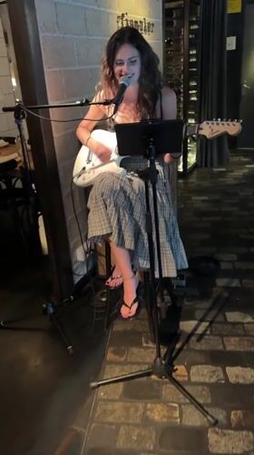 Live guitar set and dinner service at a Barcelona restaurant
