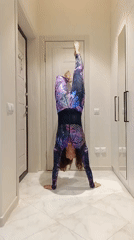 Gymnastics and flexibility drills in a Sochi hallway