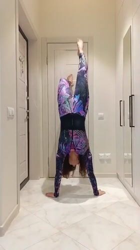 Gymnastics and flexibility drills in a Sochi hallway