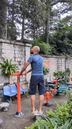 Morning workout at a Da Lat park, insects and city streets nearby