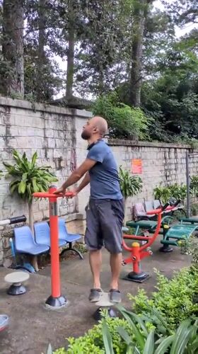 Morning workout at a Da Lat park, insects and city streets nearby