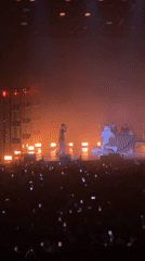 High-energy concert performance captured in Moscow featuring white-clad performer