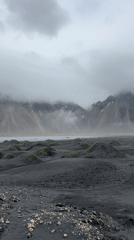 Tourist visits Iceland's black sand beach with Land Rover