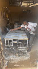 Nigerian artisans craft gold-veined countertop in outdoor workshop