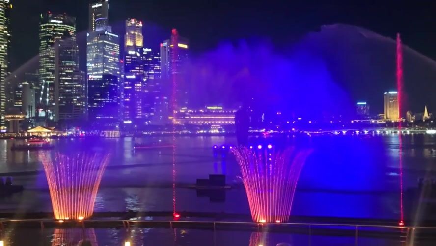 Colorful fountain show lights up Singapore skyline at night
